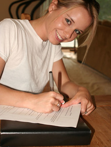 Young blonde stands naked before signing nude model release forms
