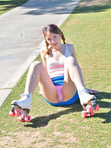 Pretty pigtailed teen gets naked and poses in public in her roller skates