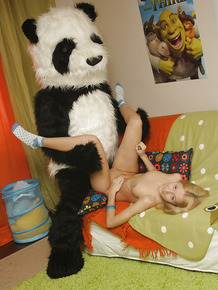 Sweet teenage blonde enjoys a hardcore play with her panda toy