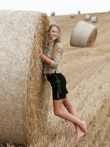 Busty seductive Carisha shows big country girl boobs & strips in the hay field