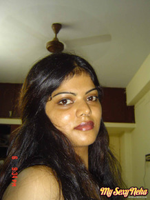Indian woman Neha takes self shots while she holds her face firm