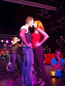 Tattooed redhead gets up on the stage and ha sex with the lead singer