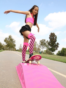 Tiny Asian teen Amai Liu posing in short skirt on the skateboard