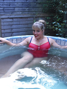 Hot fatty mature Danielle T sheds swimsuit to pour cold water on her big tits