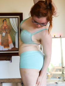 Pale redhead Panda shows her unshaven chubby body with her glasses on