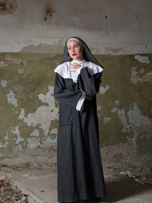 18 year old nun Judith Able removes her clothing to model naked