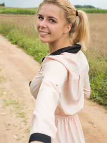 Young blonde Yelena gets totally naked in a farmer's field