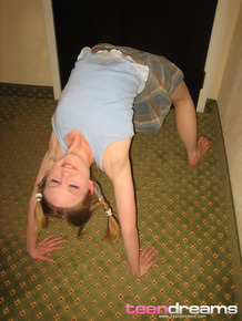 Adorable teen Kitty Kim strips naked behind a closed hotel room door