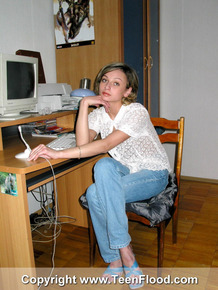 Horny female student Irina gets naked at the computer desk