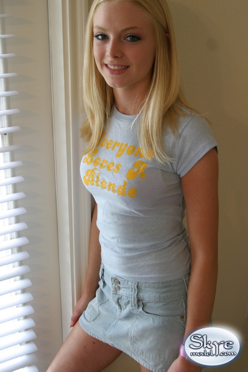 Blonde amateur Skye Model models by herself in a short skirt pic