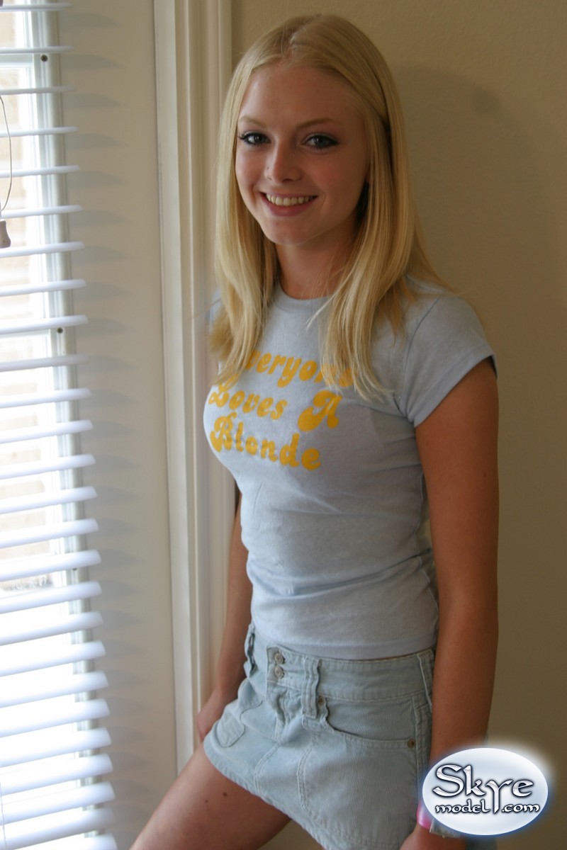 Blonde amateur Skye Model models by herself in a short skirt pic