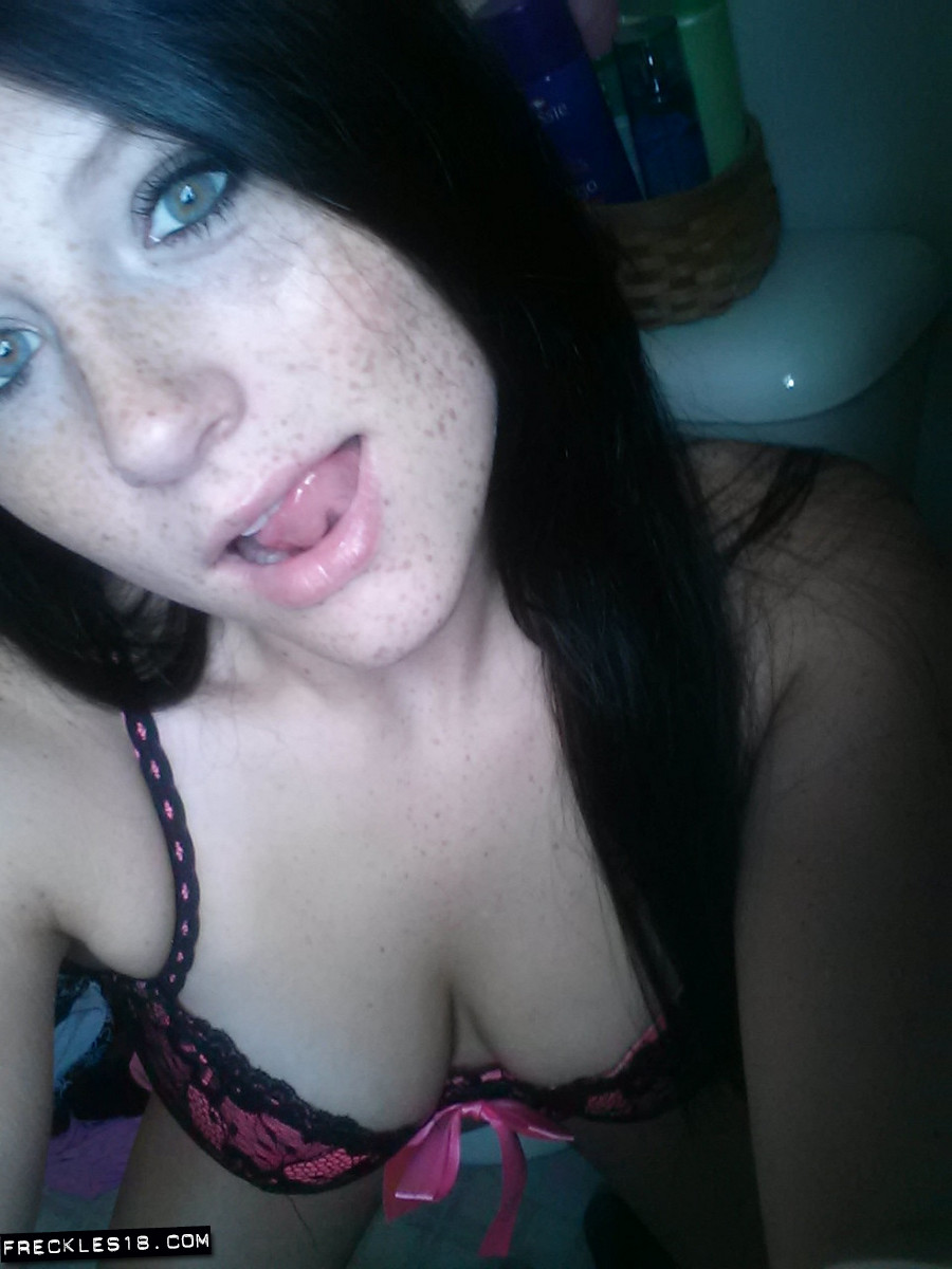 Self shot of amateur Freckles in stockings and sexy lingerie showing tongue pic