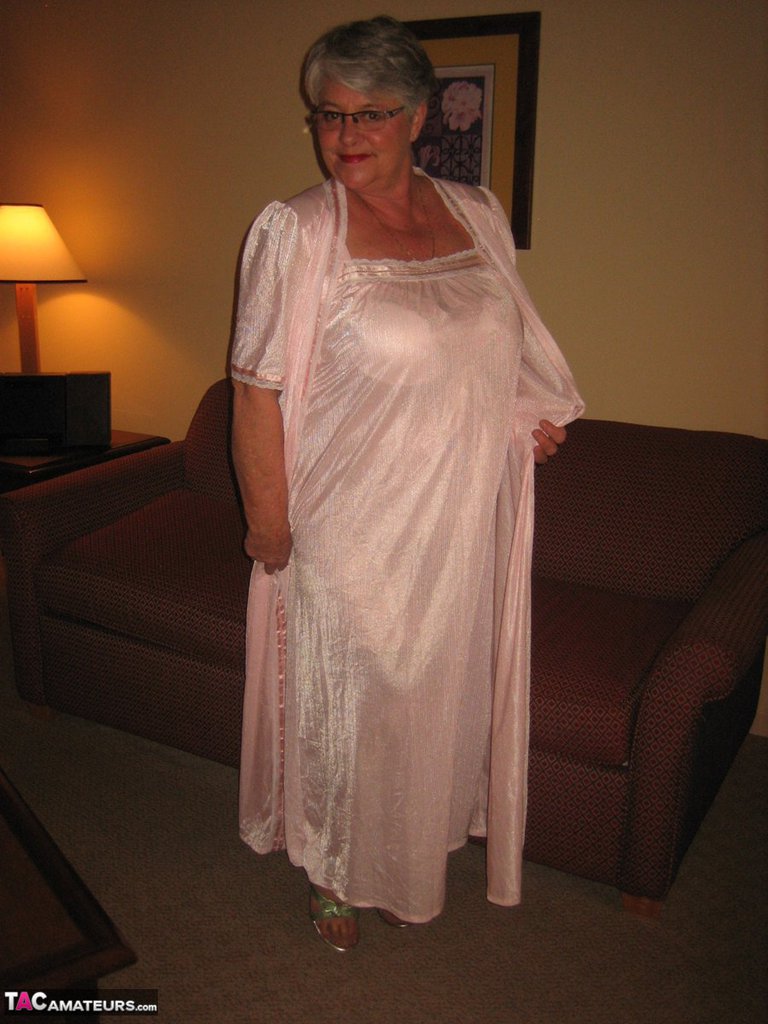 Amateur granny on the heavy side shows her pussy in lingerie and tan nylons  photo