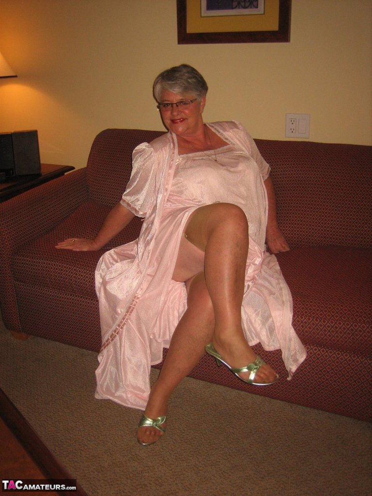 Amateur granny on the heavy side shows her pussy in lingerie and tan nylons  picture