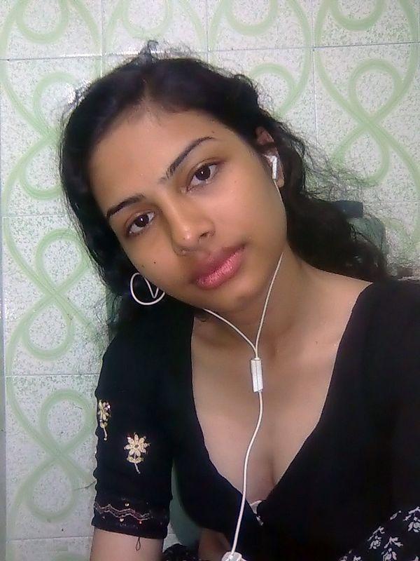 Indian wife listens to music while setting her natural tits free pic