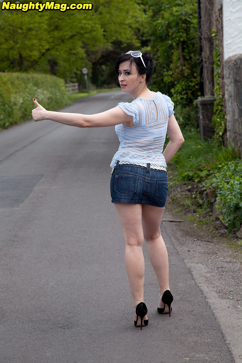 Dark haired amateur Jena flashes panty upskirt spreading legs outdoors image