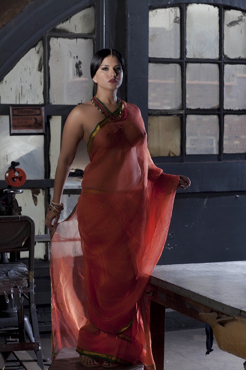 Busty solo girl Sunny Leone models solo in see thru Indian attire pic