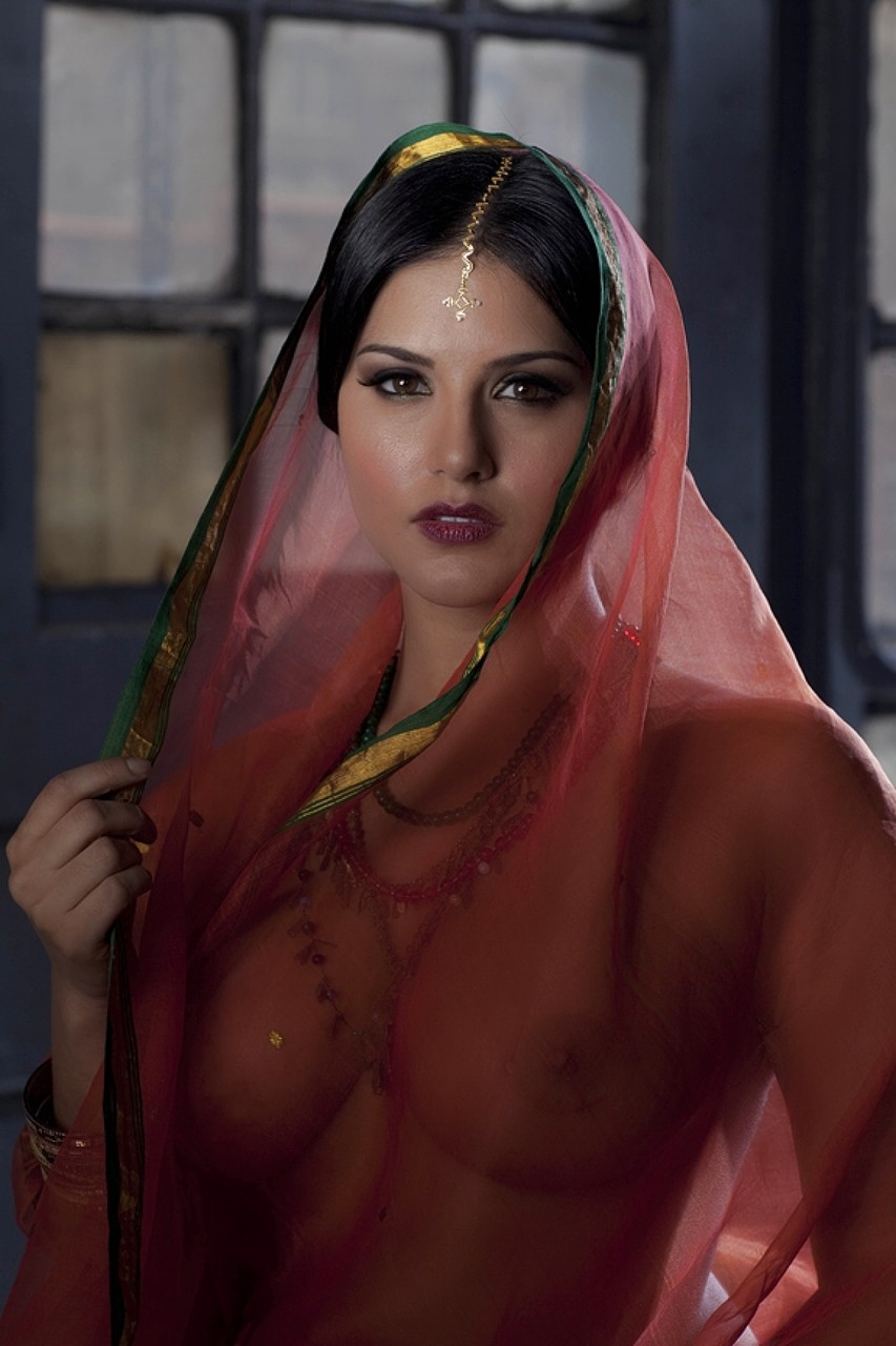 Busty solo girl Sunny Leone models solo in see thru Indian attire picture