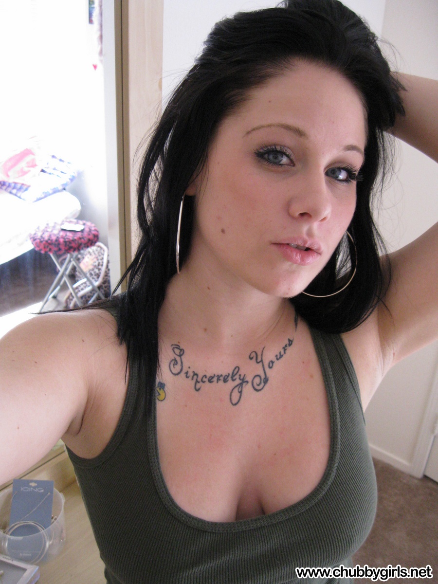 Dark haired amateur pulls out her big naturals and licks her nips in selfies photo image