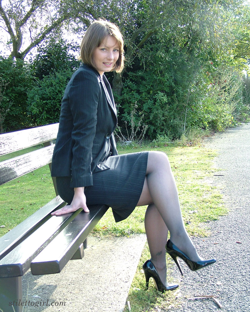 Pretty non nude woman in black stockings flaunting her heeled feet outdoors  photo
