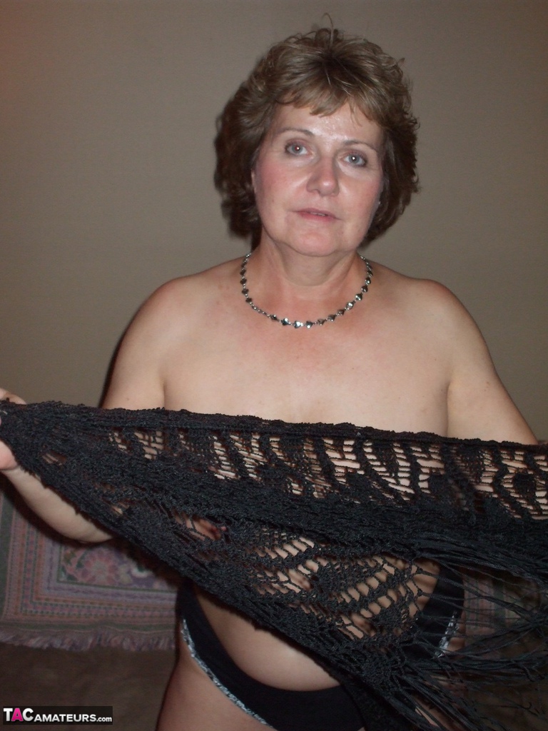 Erotic mature wife Busty Bliss shes lace shawl to spread topless in sexy thong pic image picture
