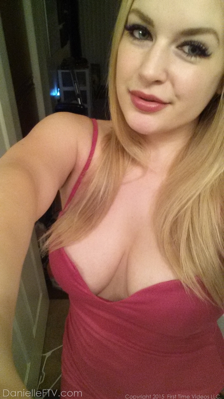 Blonde amateur with natural tits pulls out her phone for naked selfies photo