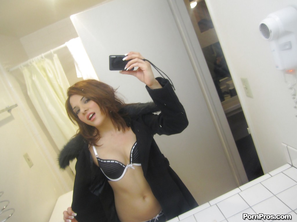 Sexy ex-girlfriend Evilyn Fierce taking selfies while stripping down to thong photo