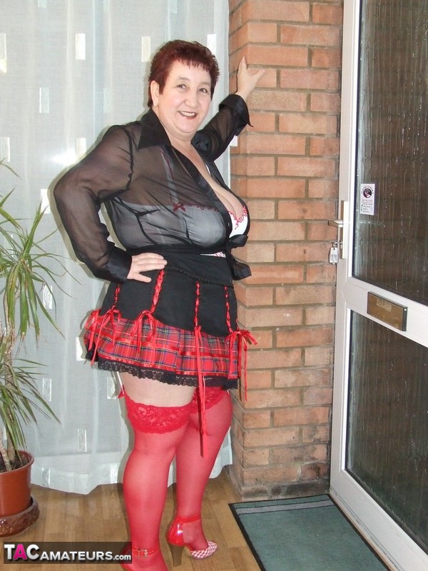 Fat amateur with short hair Kinky Carol exposes her huge tits in red nylons  pic